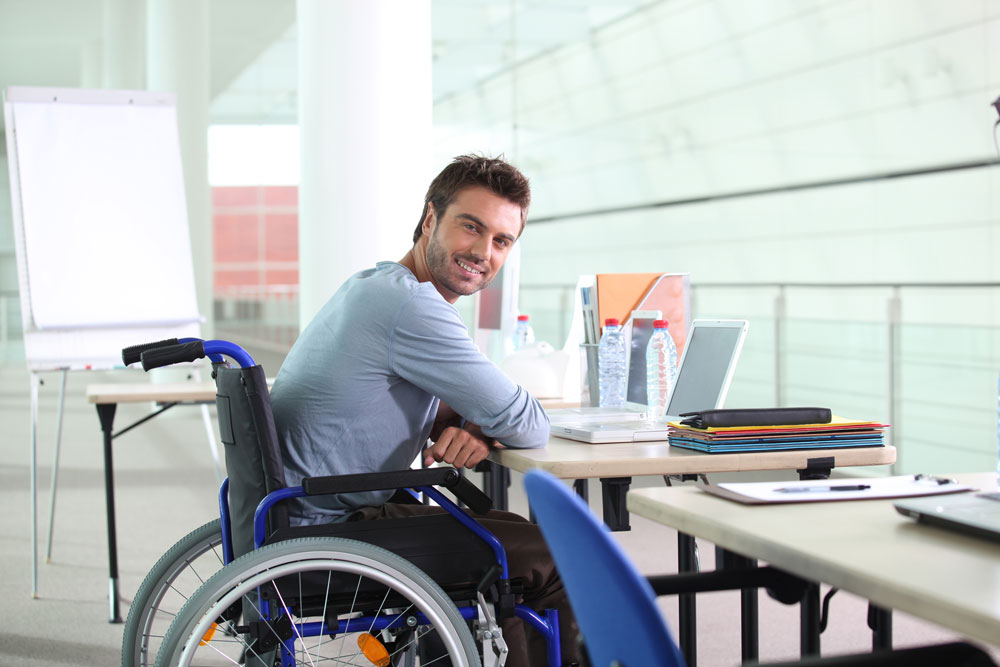 smiling man in wheelchair