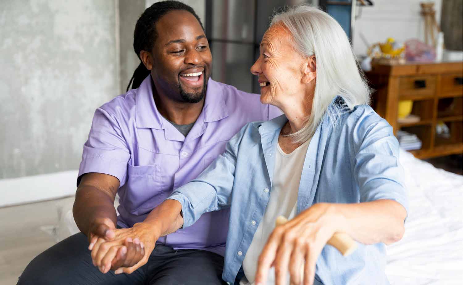 caregiver taking care of an elderly woman