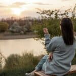 caregiver self-care woman sitting outdoors and relaxing