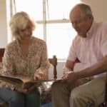 caregiver spouse helping disabled husband