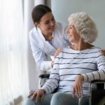 woman in wheelchair with caregiver