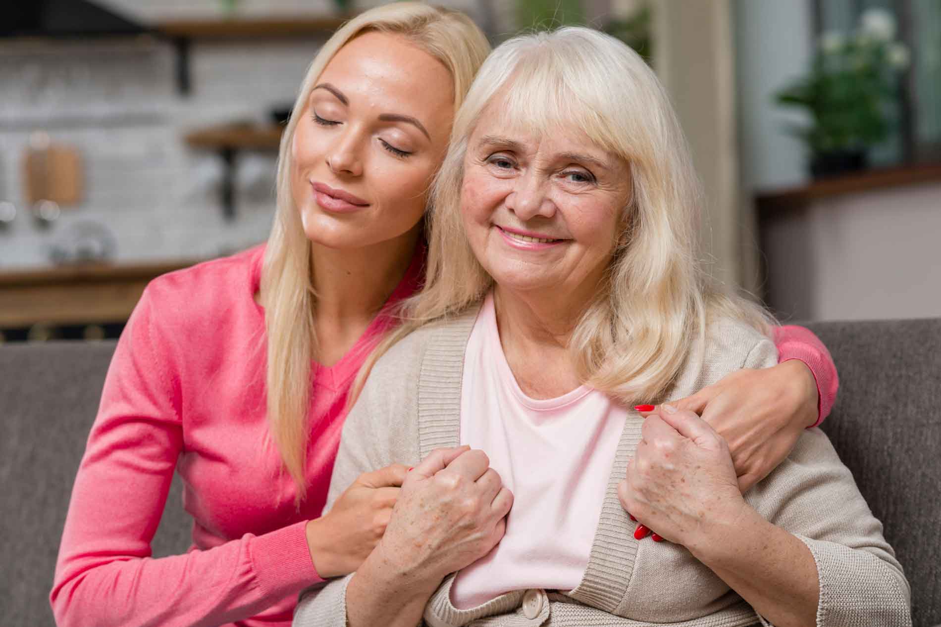 Two certified women smiling together.
