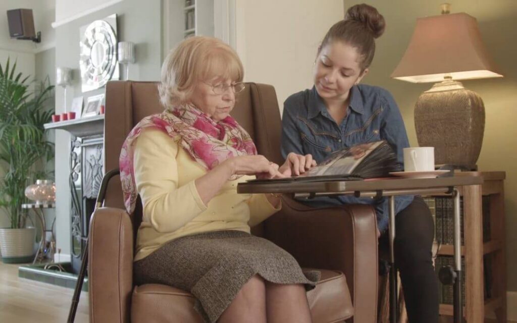 two women reading together
