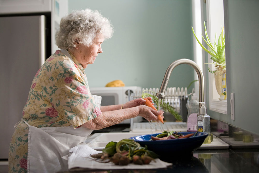 woman-cleaning-vegetable