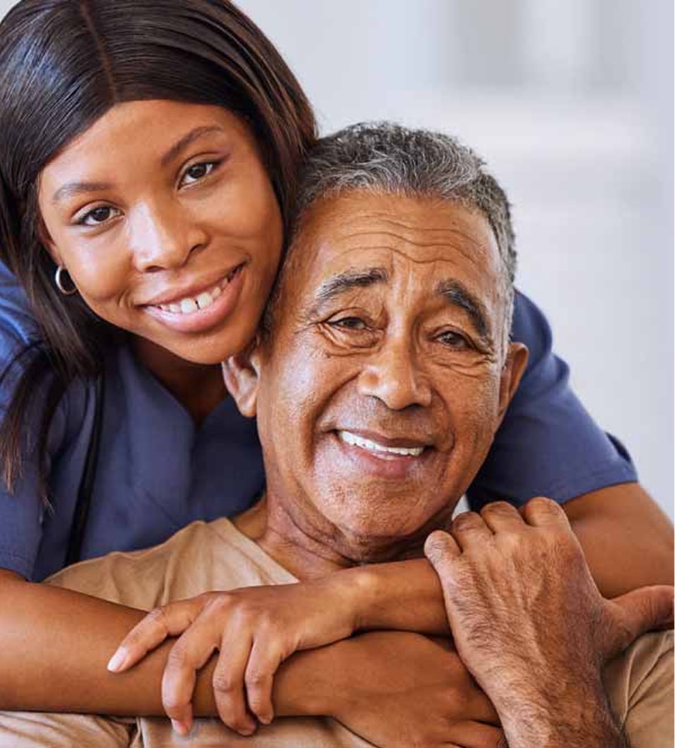 daughter caregiver with father smiling