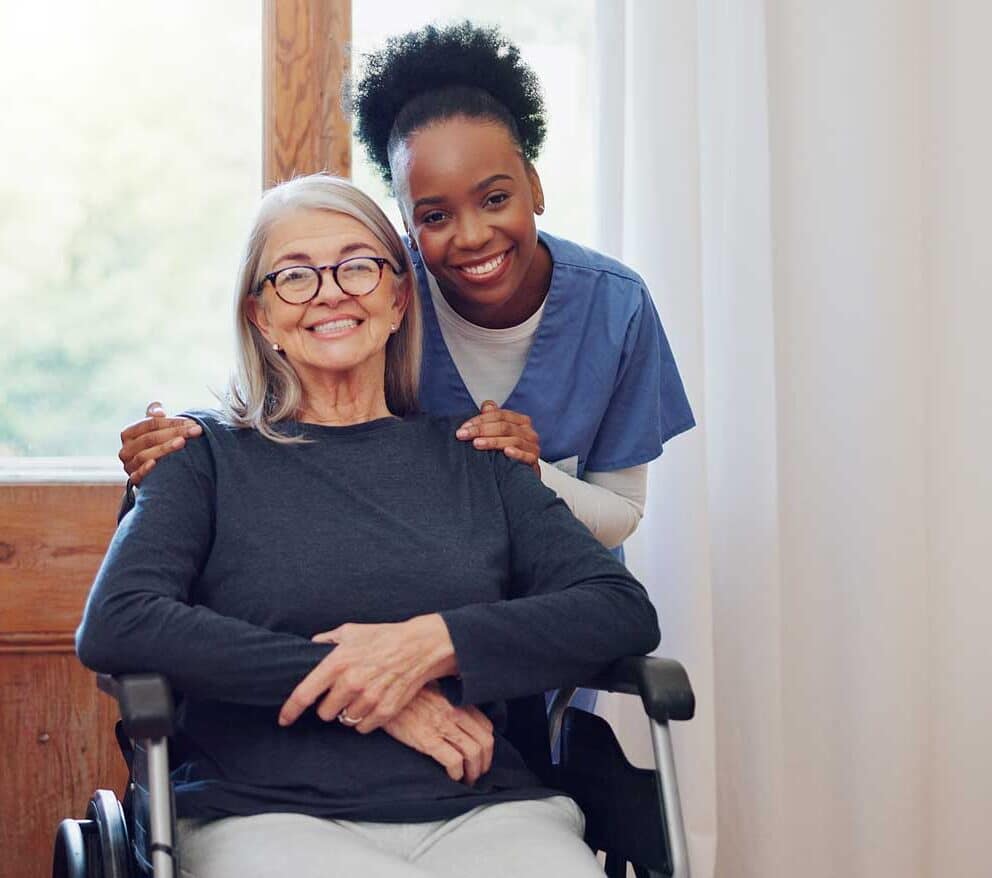 senior care caregiver with woman with wheelchair portrait smile